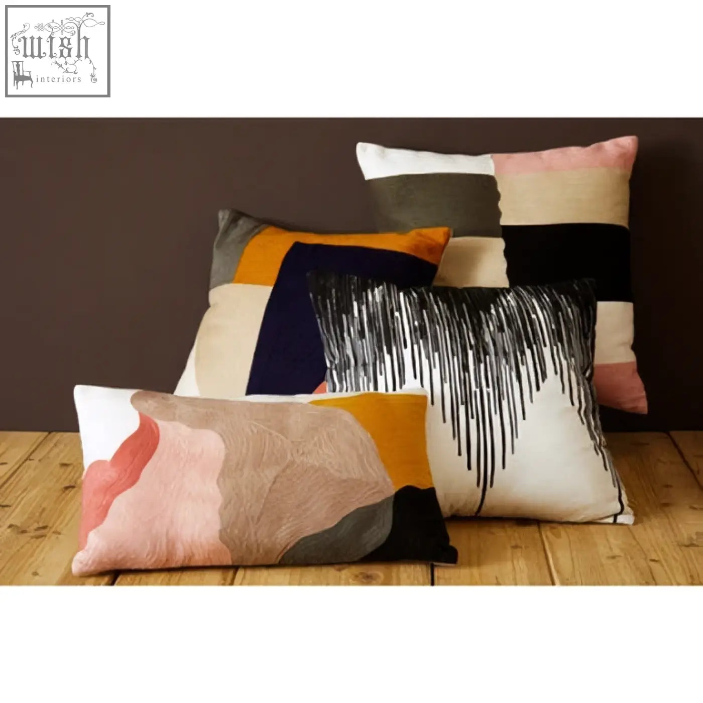 A bosie ozella patch design cushion featuring modern abstract patterns in soft pastels and bold earth tones