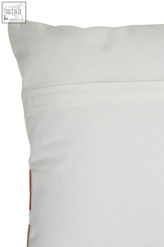 Bosie ozella red and white tonal cushion featuring a white tonal cushion with smooth textured fabric and subtle stitching