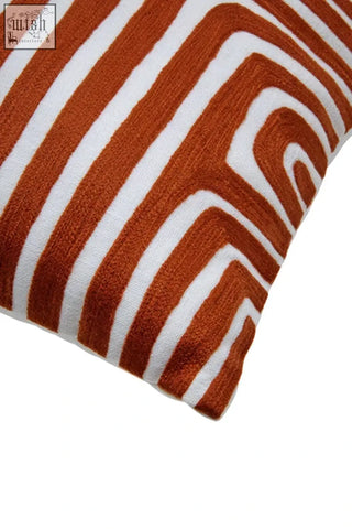 A bosie ozella premium cotton square white cushion with rust orange zigzag bold geometric pattern