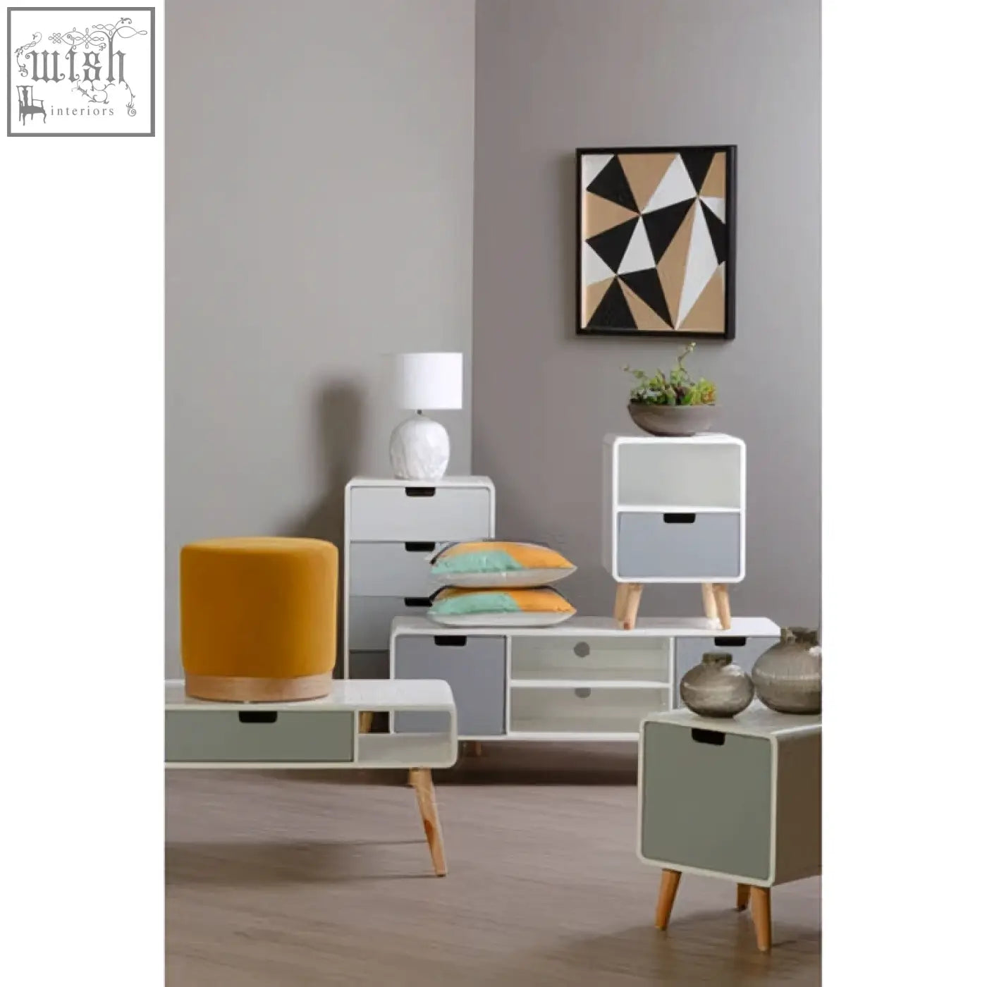 Modern minimalist storage unit with white and gray finish, wooden legs, and drawers shown with bosie ozella wavy stripes cushion