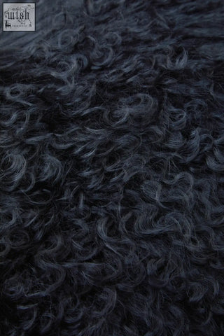 Dark curly faux fur texture of bosie real mongolian fur black rectangular cushion for cozy decor