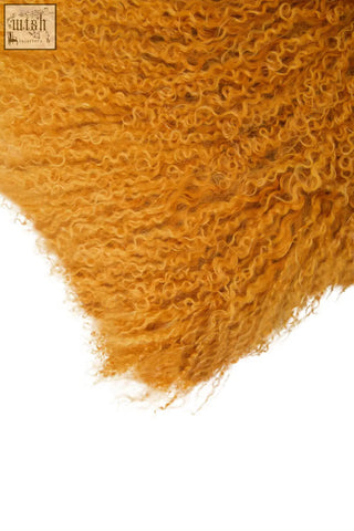 Bosie real mongolian lamb fur ochre rectangular cushion with plush golden-orange curly soft texture