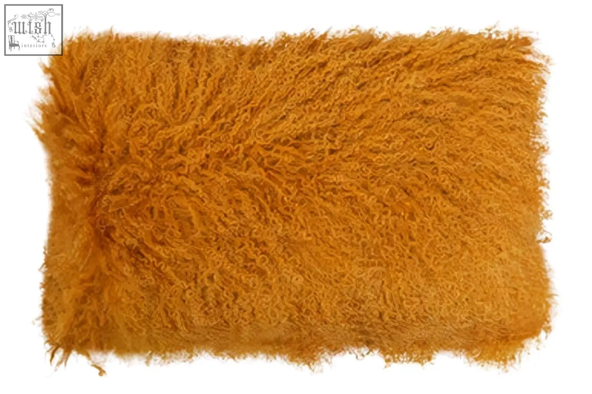 Bosie real mongolian lamb fur rectangular cushion with plush golden orange shaggy faux fur and frayed edges