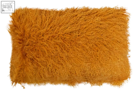 Bosie real mongolian lamb fur rectangular cushion with plush golden orange shaggy faux fur and frayed edges