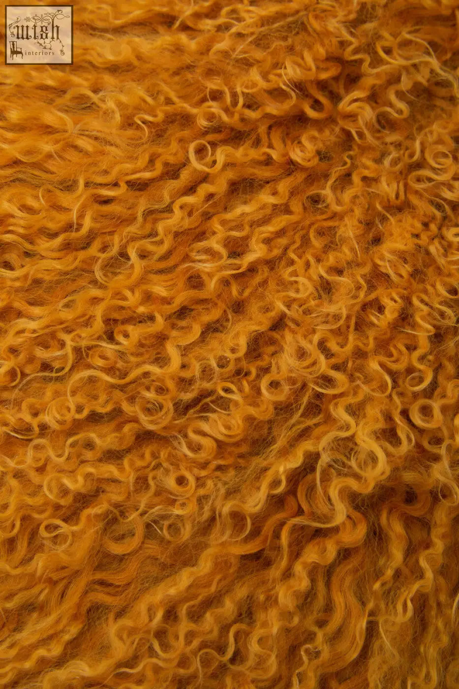 Bosie real mongolian lamb fur ochre rectangular cushion with rich golden-orange curly wool and plush textured surface