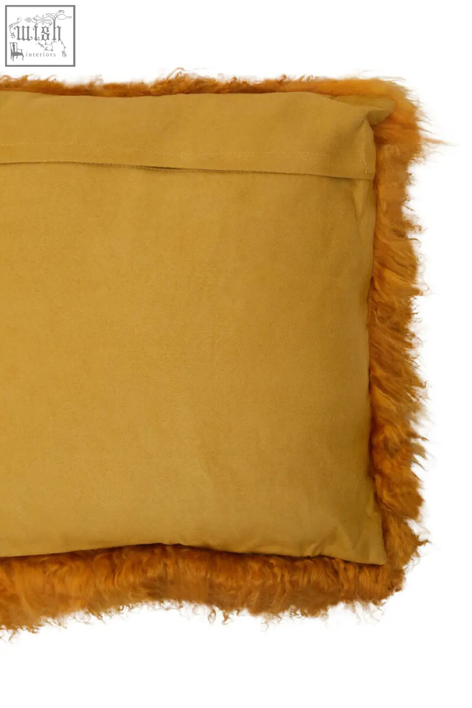 A mustard-yellow bosie real mongolian lamb fur cushion with plush fuzzy fringe trim