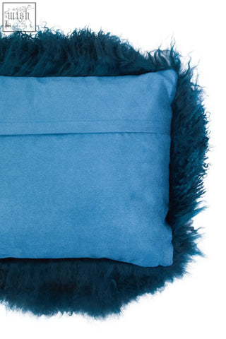 Blue velvet rectangular cushion with dark teal curly mongolian lamb fur trim from bosie real mongolian fur collection