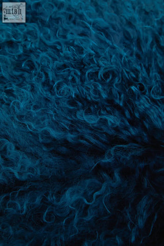Deep blue bosie real mongolian fur lamb fur cushion with curly plush soft textured surface in teal square design