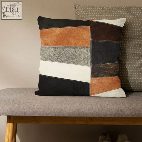 Bosie safira neutral colourblock hair on leather patchwork cushion in black brown tan and gray tones with visible stitching