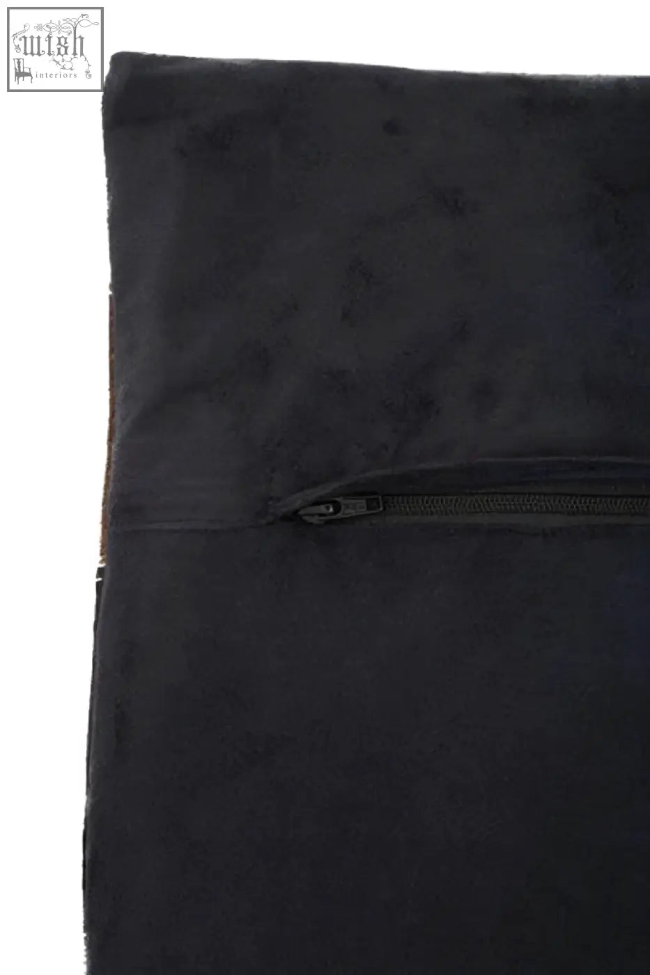 Black suede garment bag with horizontal zipper closure shown alongside bosie safira neutral colourblock leather patchwork cushion