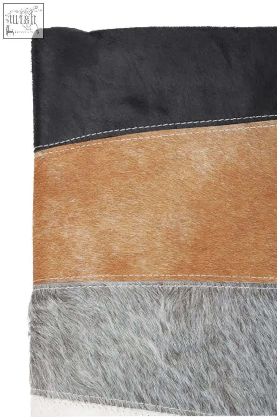 Black tan and gray bosie safira hair on leather patchwork cushion with stitched horizontal stripes for cozy style