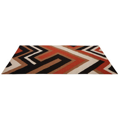 A rectangular bosie villon zig zag pattern rug with bold black orange and cream geometric zigzag design