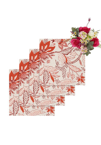 Set of four cream bossa nova table napkins with vibrant red and pink botanical leafy print perfect for dining use