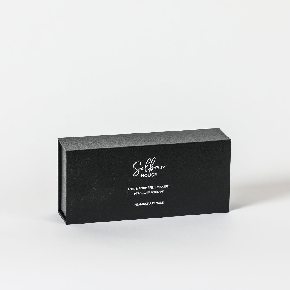 Black rectangular gift box with white cursive lettering for selbree house roll and pour spirit measure enhancing pouring experience