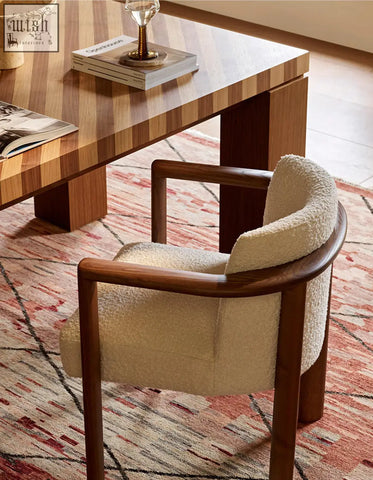 Cream-colored shearling upholstered boucheron dining chair with solid wood frame perfect for dining room seating