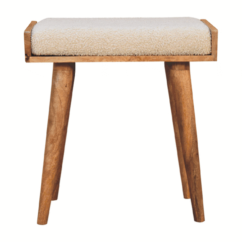 Beige plush cushioned boucle cream tray style footstool with natural wood frame and tapered legs