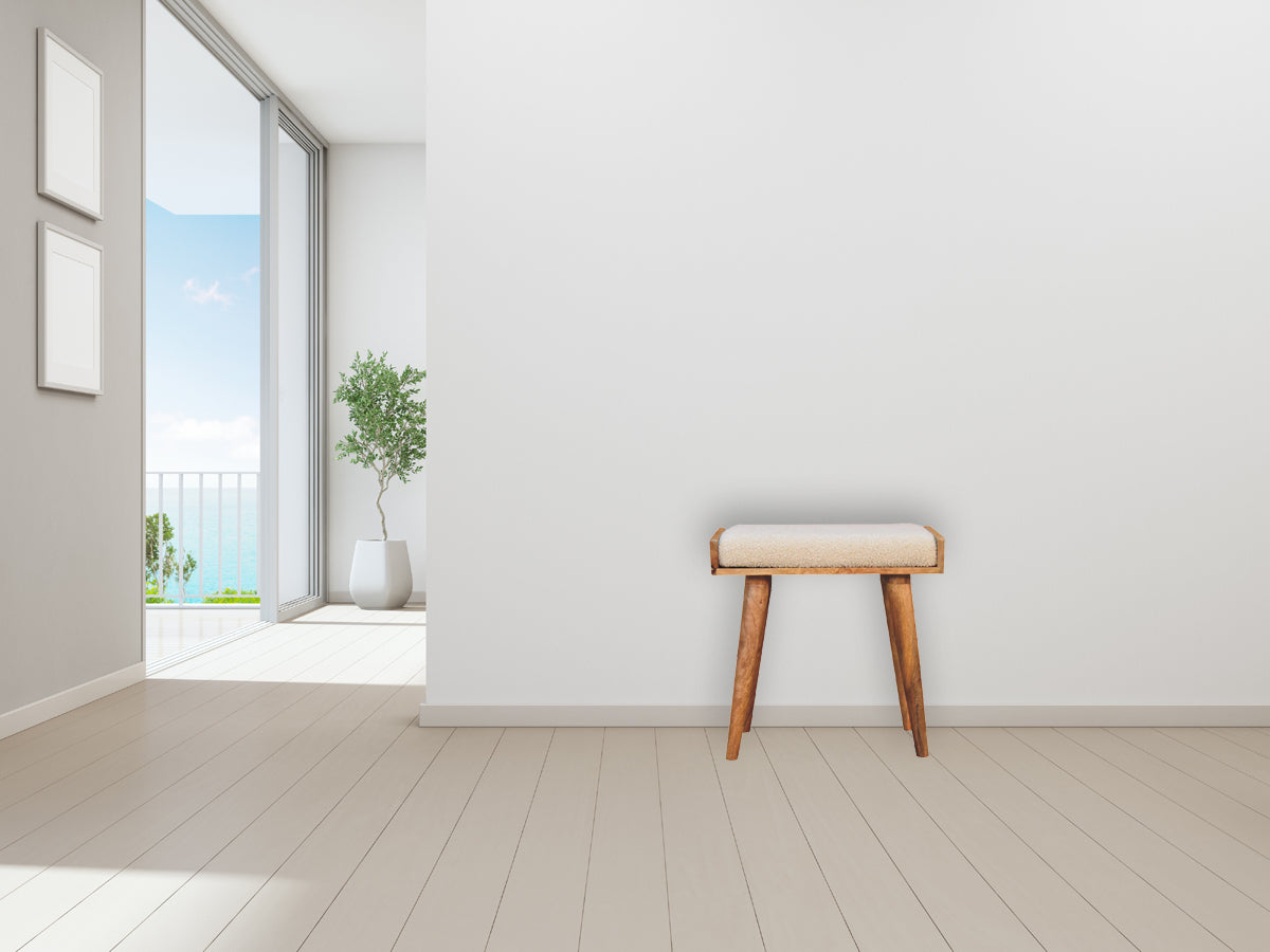 Beige boucle cream tray style footstool with plush cushion and natural wood tapered legs for comfy seating