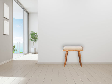 Beige boucle cream tray style footstool with plush cushion and natural wood tapered legs for comfy seating