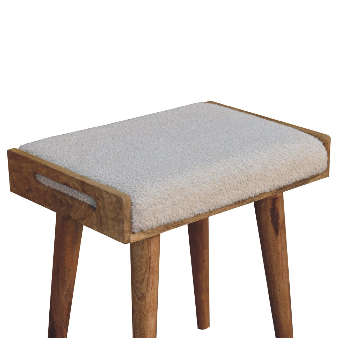 Boucle cream tray style footstool with cozy off-white sheepskin cushion and natural wood tapered legs