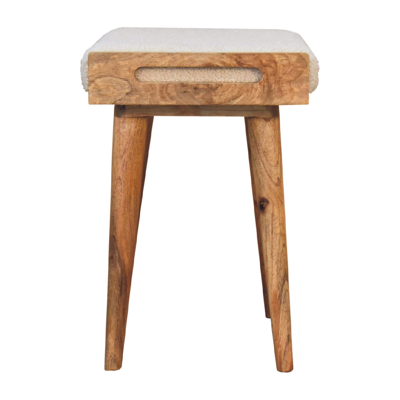 A rustic wooden tray style footstool with cream boucle upholstery and tapered legs perfect for extra seating