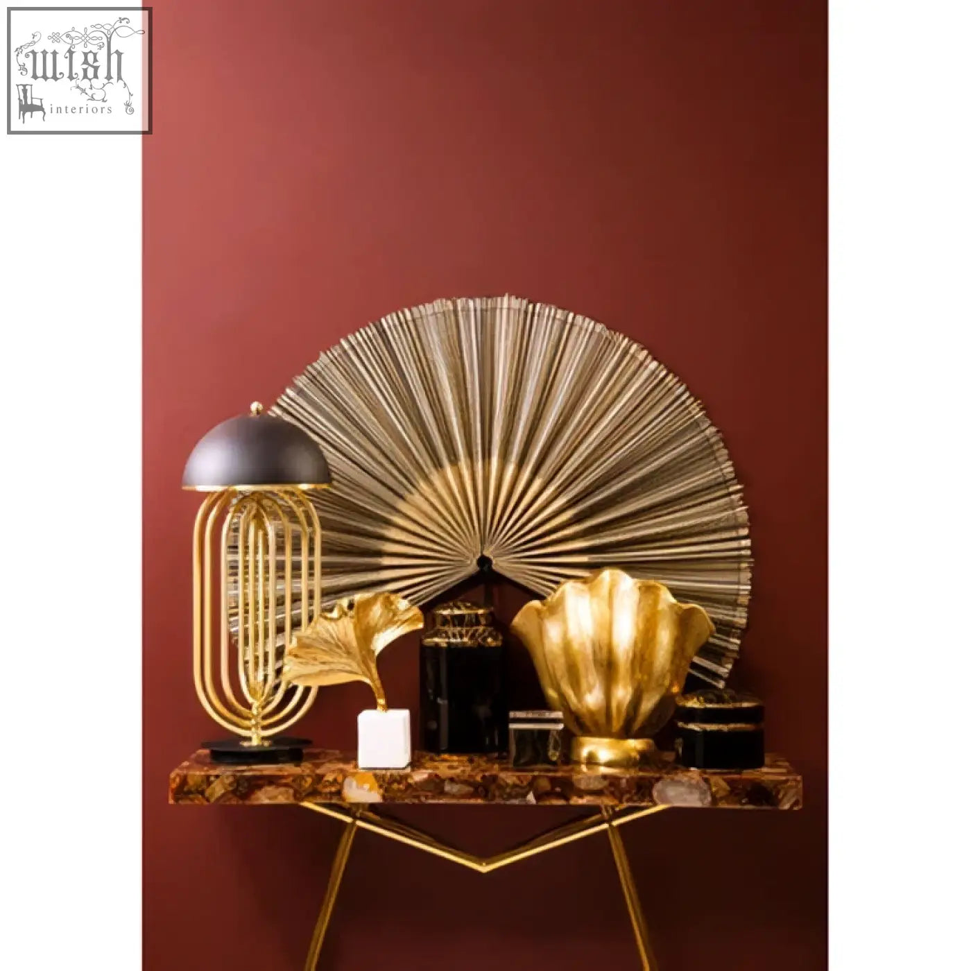 Gold-toned fan-shaped wall art with metallic ribbed texture complementing bowerbird black agate trinket box design