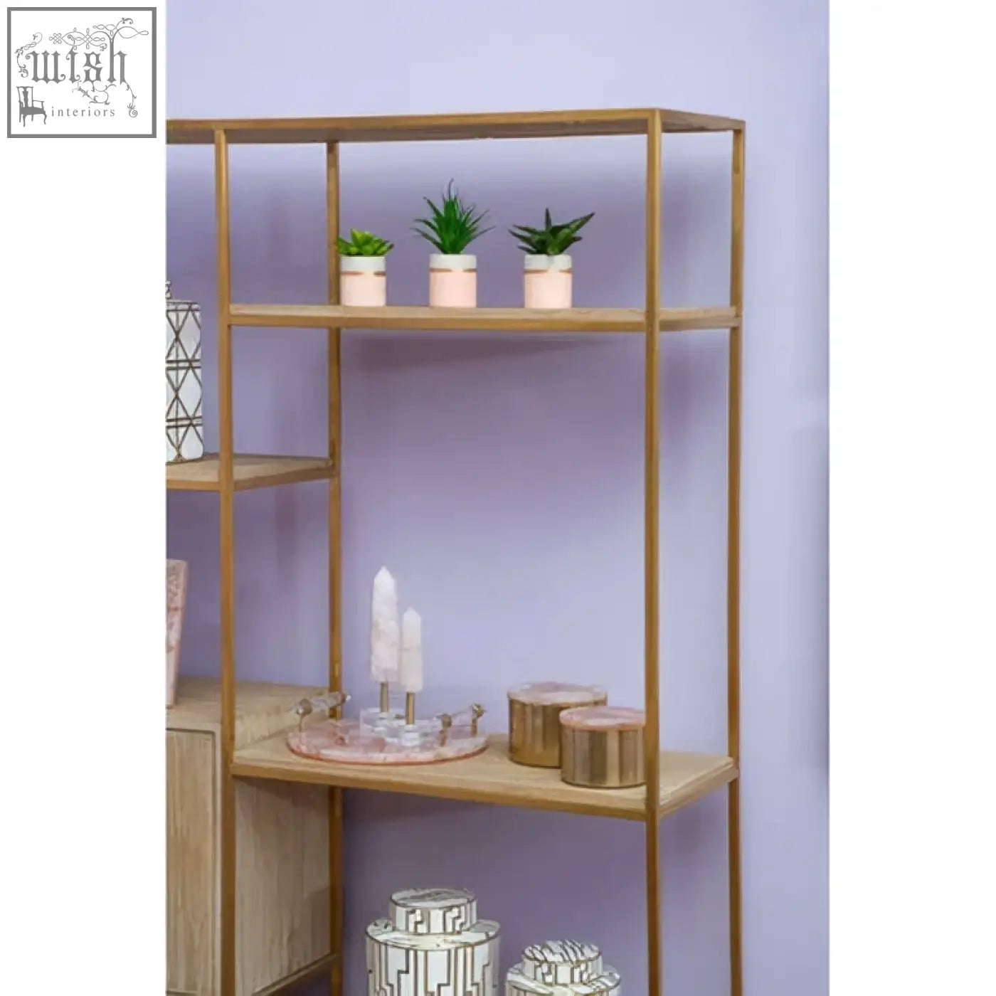 Gold metal and wood shelving unit with three shelves displaying a bowerbird large quartz trinket box and decor