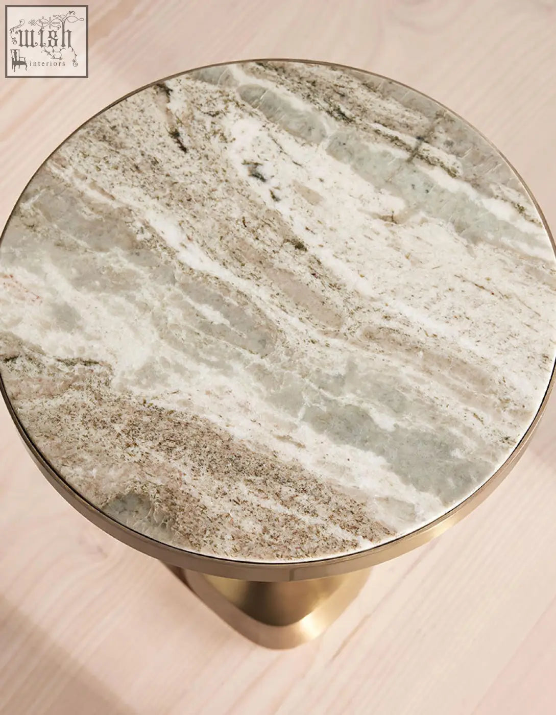 Bozkurt side table with polished marble top in gray and white veining and sleek brass base shipping cost info available