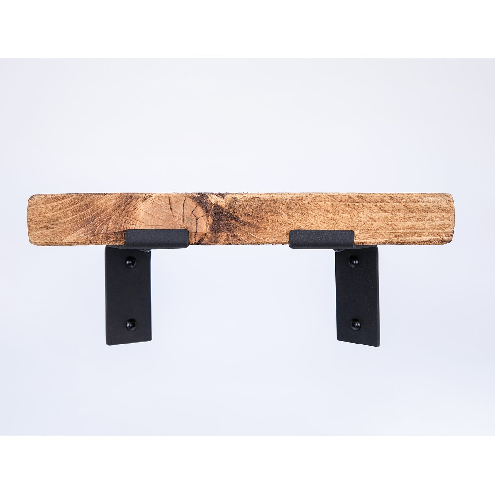 Rustic wooden shelf supported by black metal corner brackets ideal for sturdy metal corner shelf setups