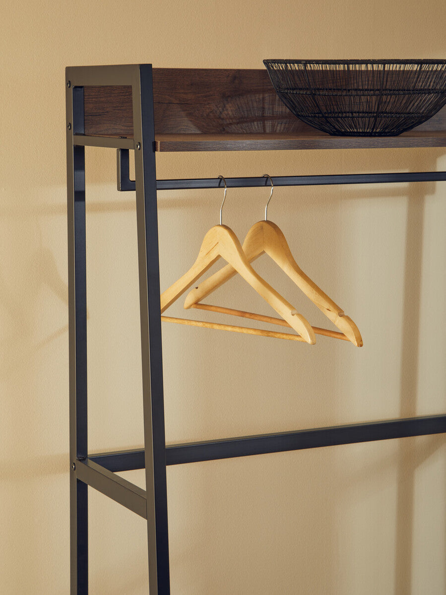 Two light wooden hangers hang on a dark metal rack inside the bradbury dark oak effect open wardrobe