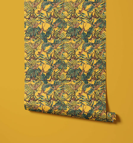 Bradley wallpaper with vibrant yellow background and brown monkeys swinging among lush green tropical leaves pattern