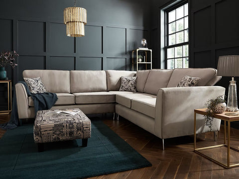 Beige upholstered brampton corner sofa with sleek metal legs decorative throw pillows and custom options