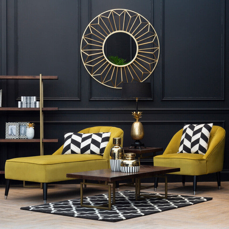 Gold geometric sunburst mirror with circular center and radiating triangular facets perfect for wall decor