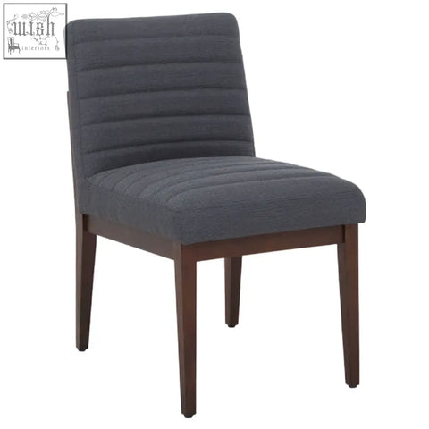 Brando charcoal grey dining chair with tufted dark gray upholstery and sleek oak legs for stylish dining rooms