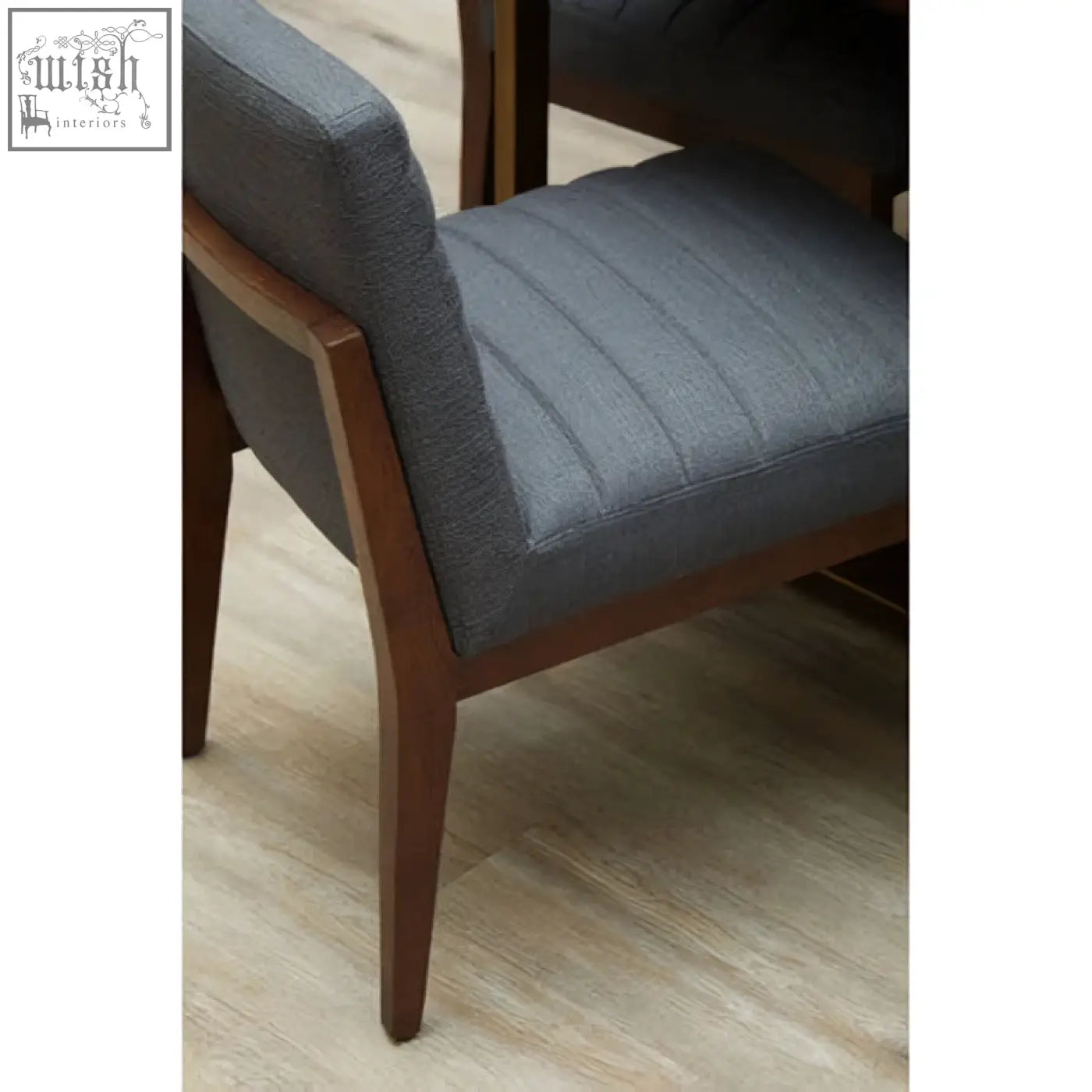 Brando charcoal grey dining chair with grey upholstered seat and oak legs featuring vertical stitching