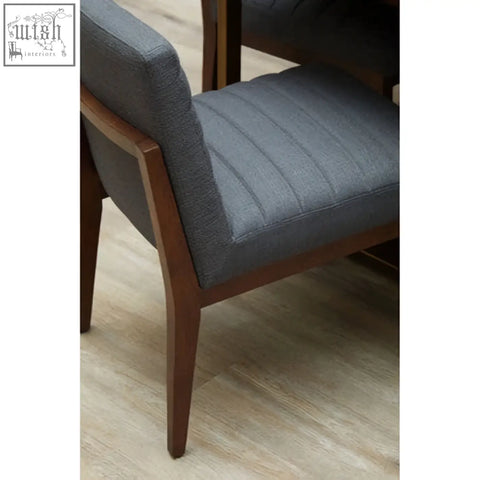 Brando charcoal grey dining chair with grey upholstered seat and oak legs featuring vertical stitching
