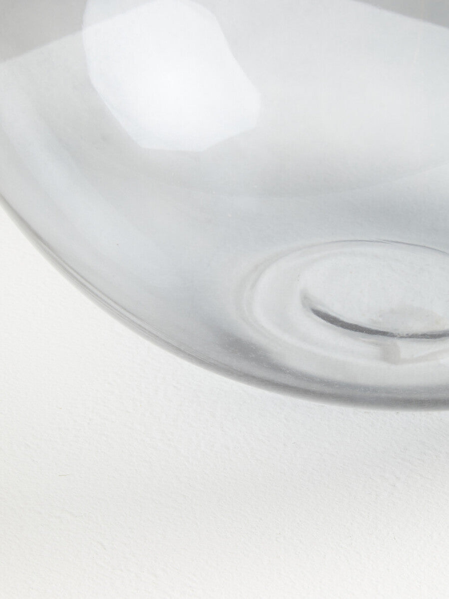 Clear glass vase with smooth curved rim and subtle concentric patterns near base from bree grey glass collection