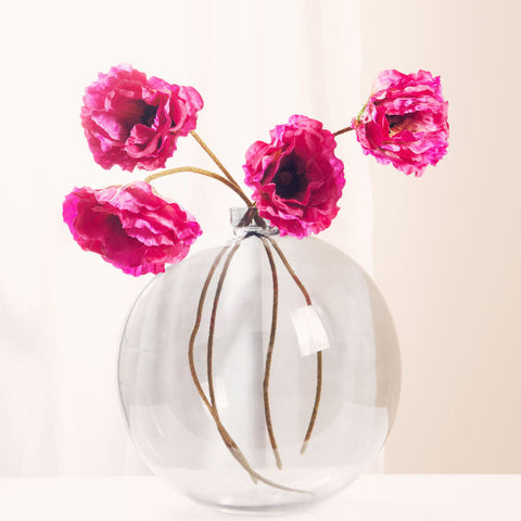 Bree grey glass clear glass vase with four vibrant pink artificial poppies and brown stems