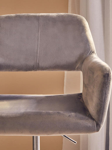 Gray velvet bar stool with sleek modern design and chrome base perfect for home office chair setup