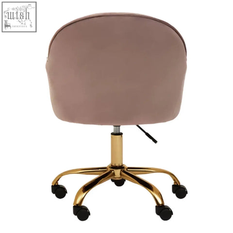 Brent pink velvet home office chair with blush pink velvet upholstery and gold-tone metal base on black caster wheels