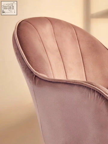 Back of a pink velvet home office chair with dusty rose velvet and elegant vertical pleats for a cozy work space