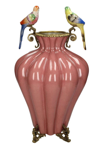Bridgerton regency style pink ceramic vase with gold metal accents and two colorful parrot figurines on handles