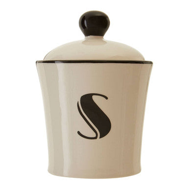Cream-colored ceramic broadway sugar canister with black lid and stylized s monogram for stylish sugar storage