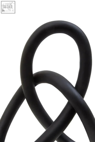 Broc black knot sculpture made of black rubber tubing in an interwoven knot pattern for modern decor