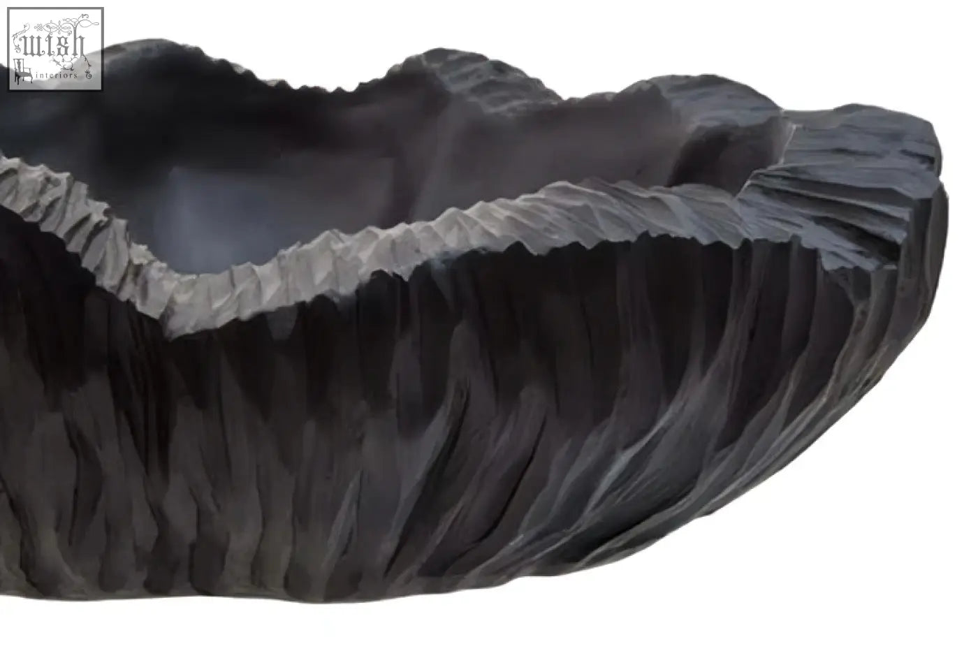 Dark gray hand-carved stone curved textured black bowl with leaf-like rim and vertical ridges perfect for serving