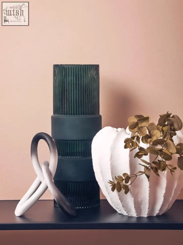 Dark green ribbed glass vase with matte black base inspired by white textured vase design for stylish decor