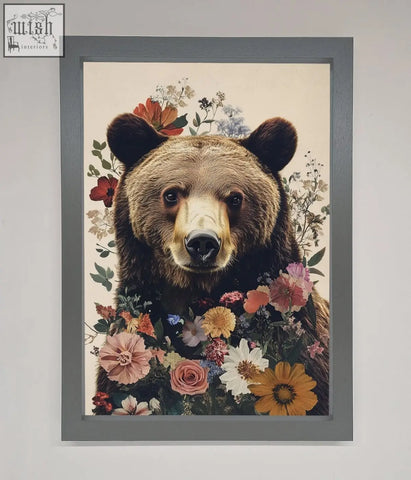 A brown grizzly bear floral framed print with colorful flowers in a sleek gray frame perfect for wall decor