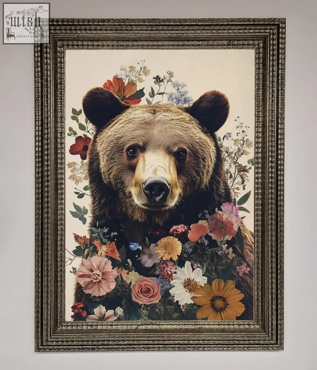 A brown grizzly bear floral framed print featuring a bear surrounded by colorful flowers in an ornate metallic frame