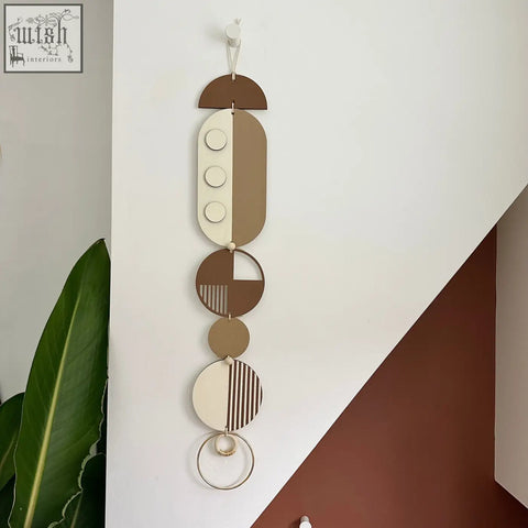Brown modern wall art featuring layered wooden geometric shapes in earthy tones for minimalist home decor