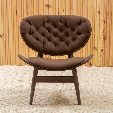 Brown tufted leather armchair with curved dark elm wood legs and sleek modern design for stylish seating