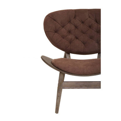 Brown tufted leather armchair with dark elm wood legs matching the brown velvet chair from vinsi collection